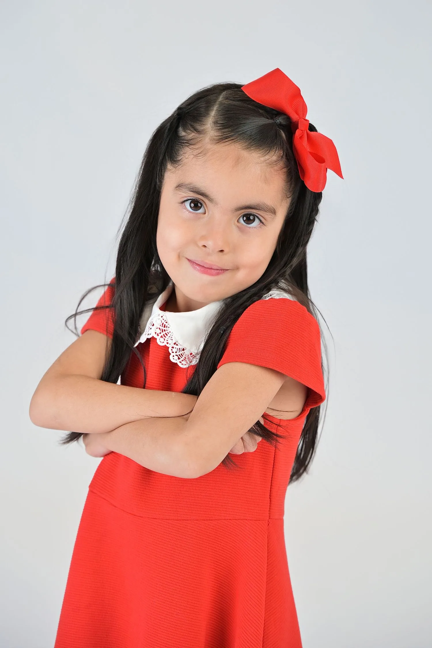 Preschool child in a polished white-background studio portrait