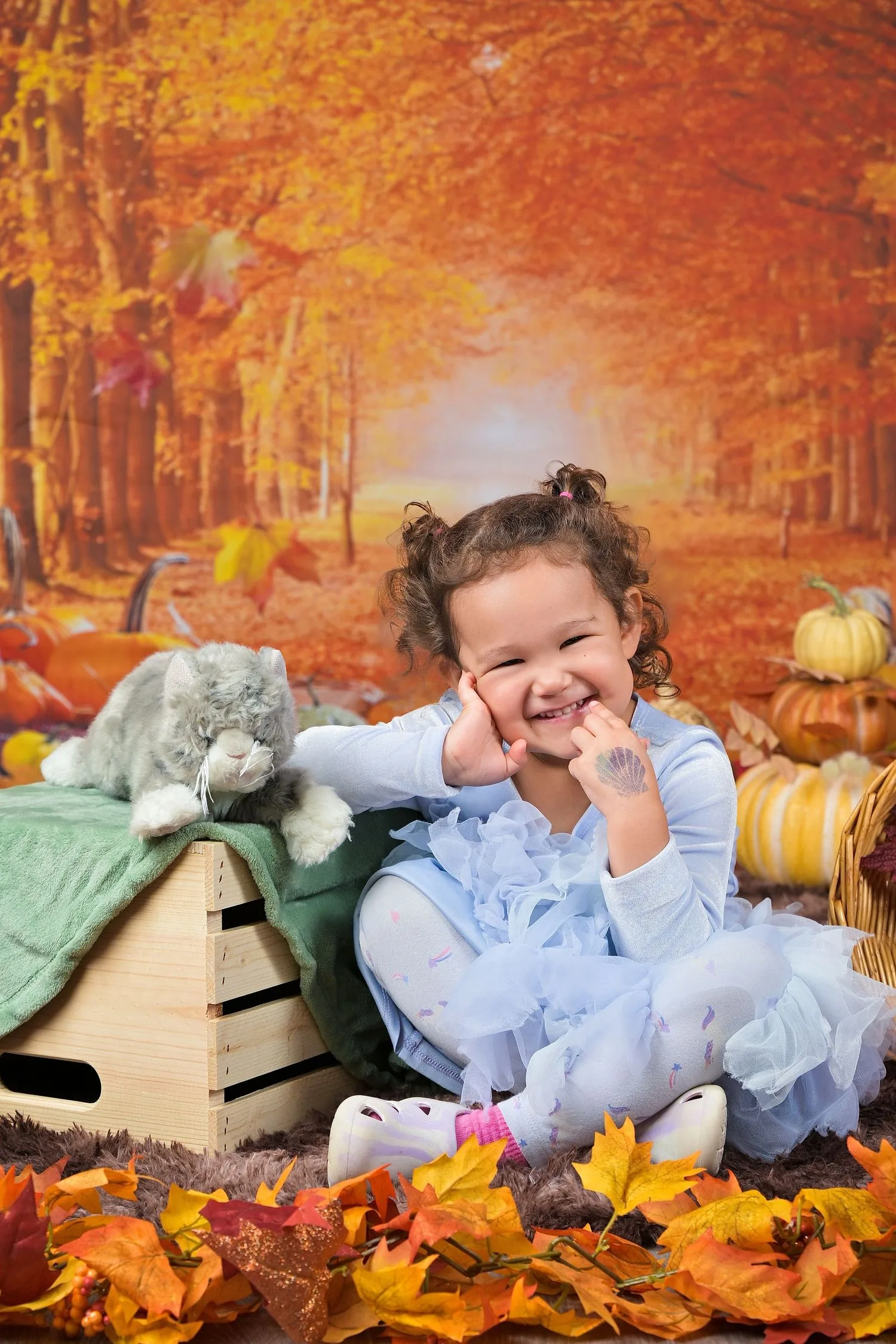 Young child photographed on a colorful portrait background