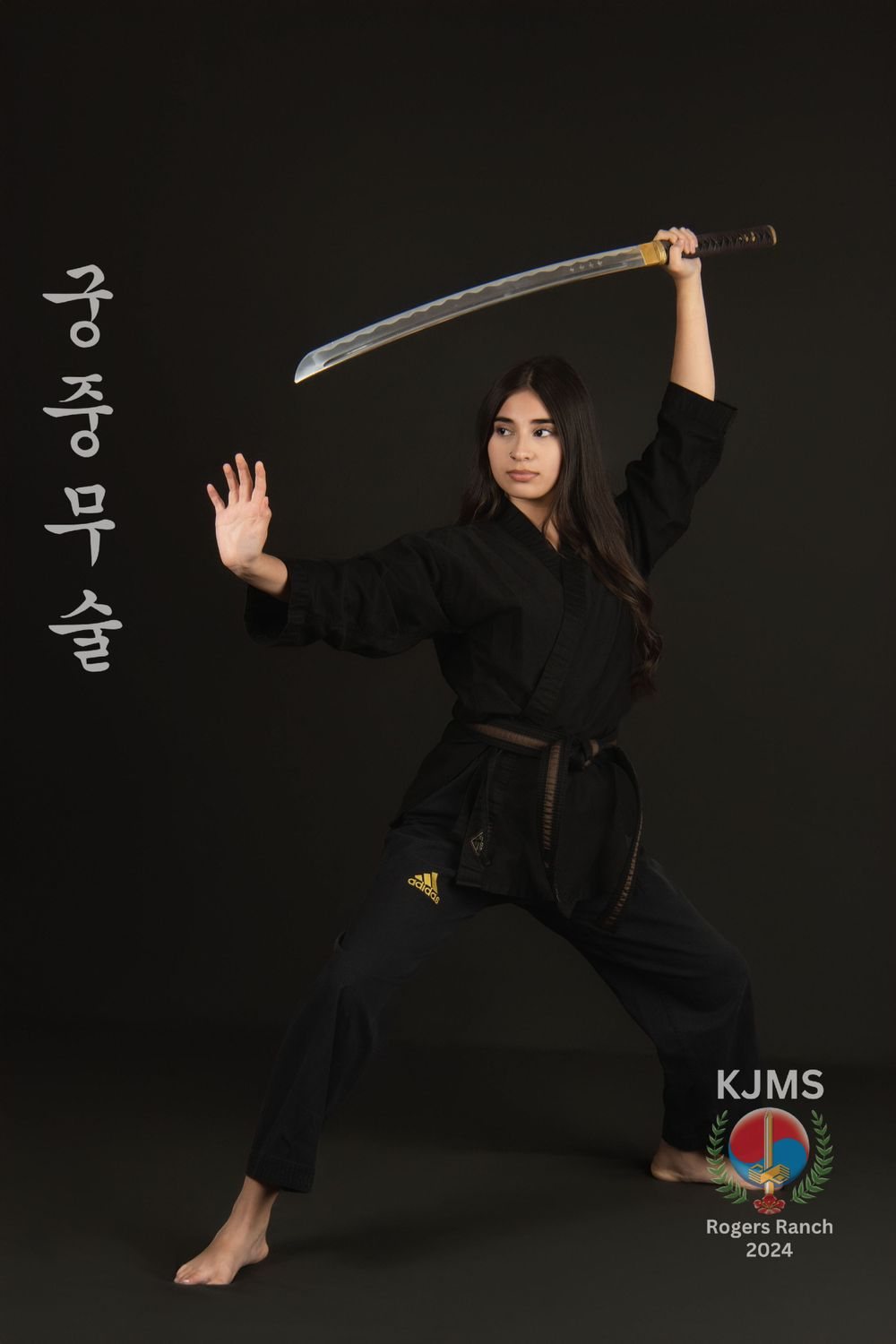 Martial arts student demonstrating a camera-ready action pose during picture day.