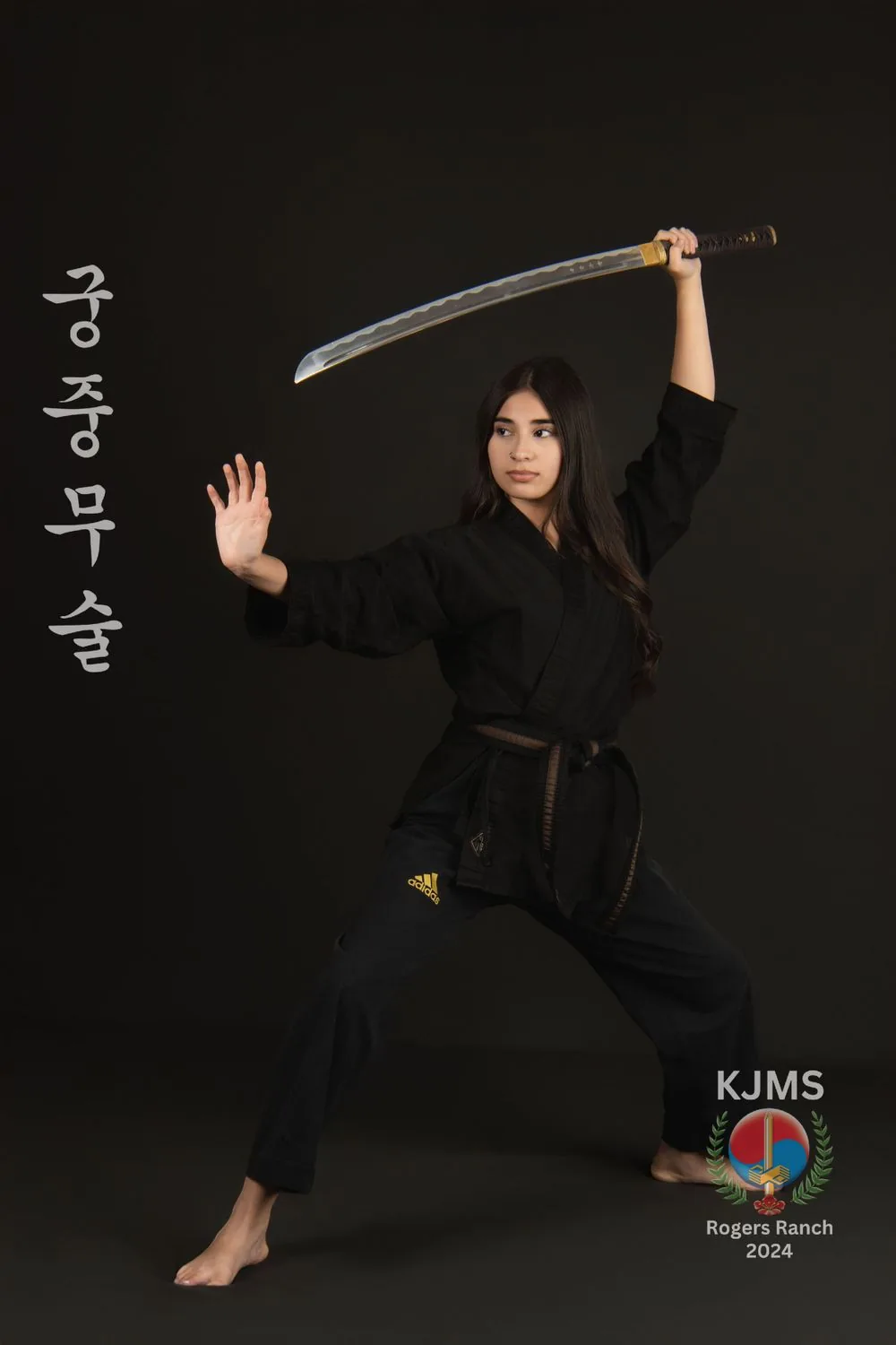 Martial arts student demonstrating a camera-ready action pose during picture day.