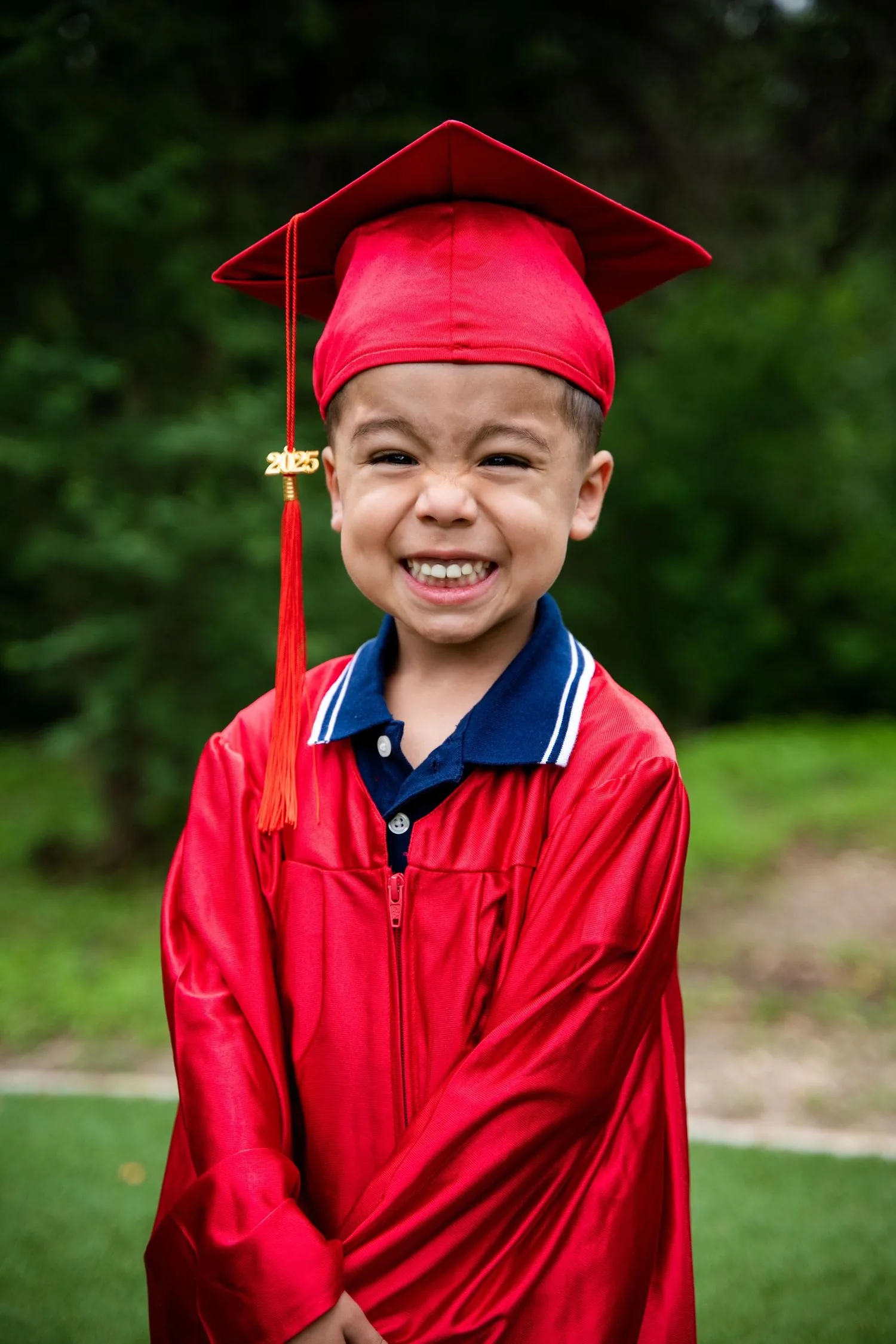 Pre-K graduate in cap and gown portrait 9