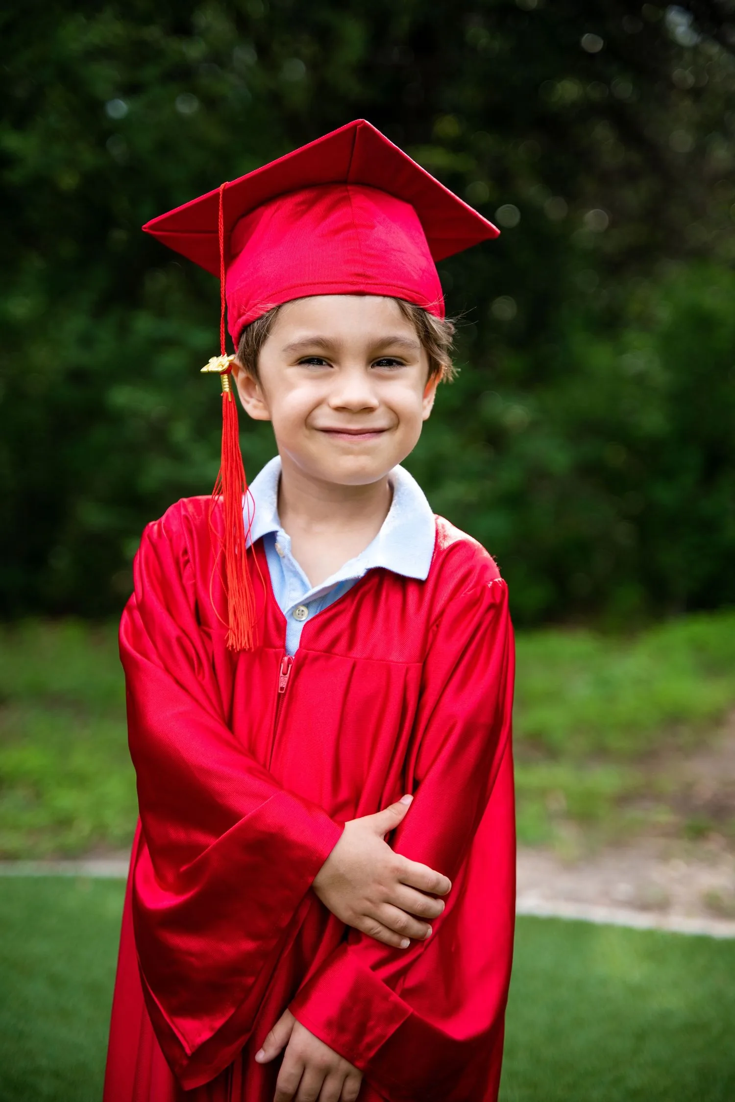 Pre-K graduate in a cap and gown portrait
