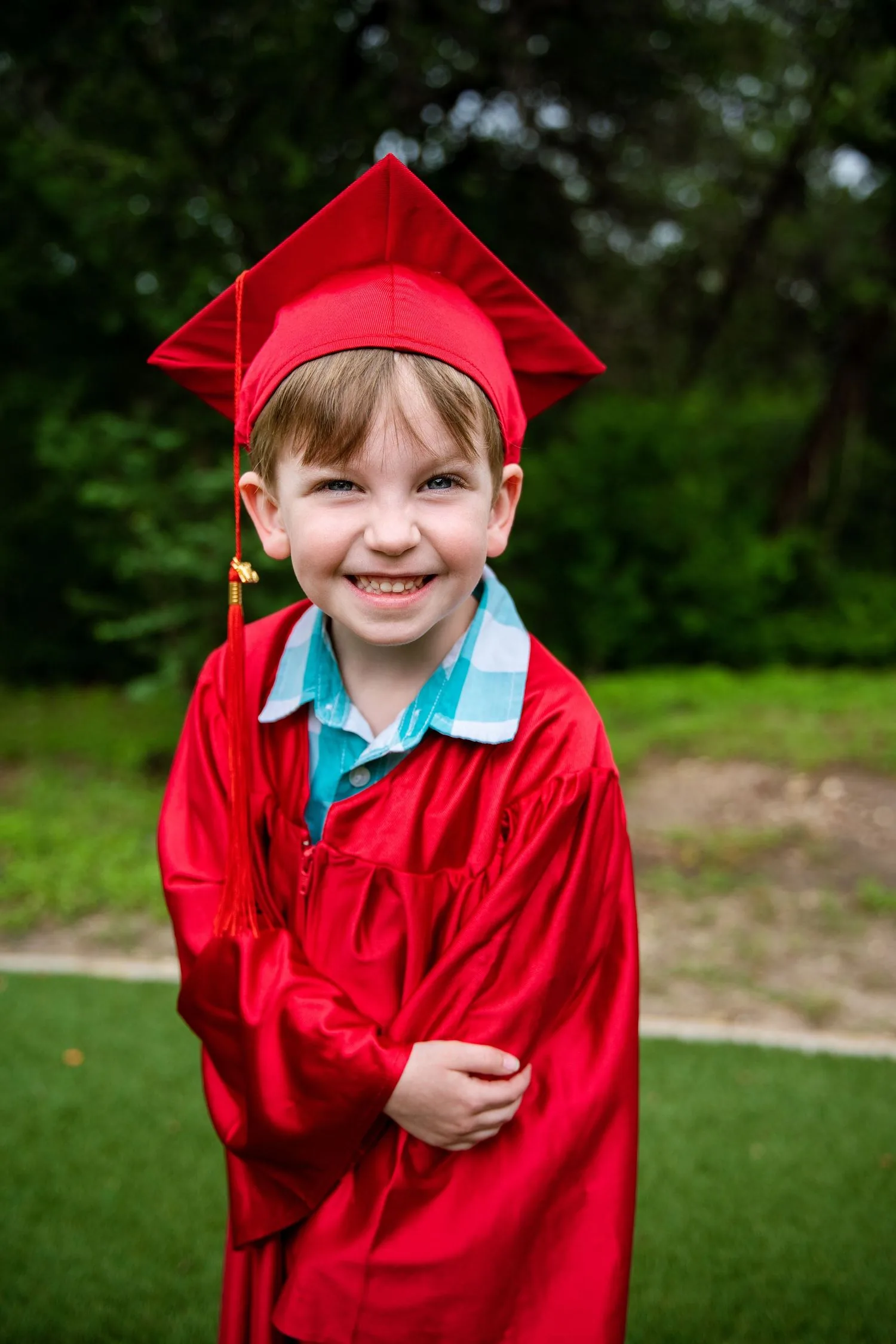 Pre-K graduate in cap and gown portrait 5