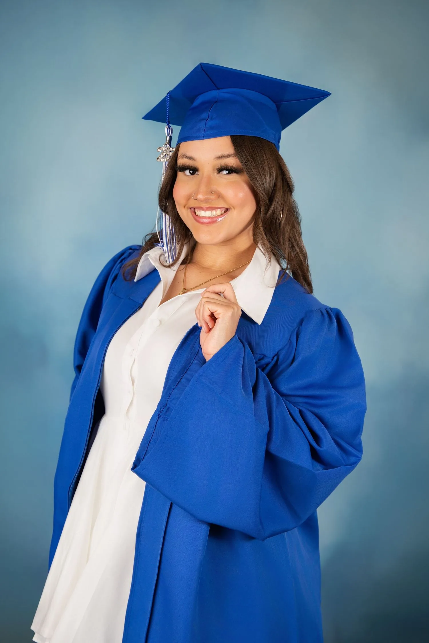 Graduating senior photographed in a polished studio portrait