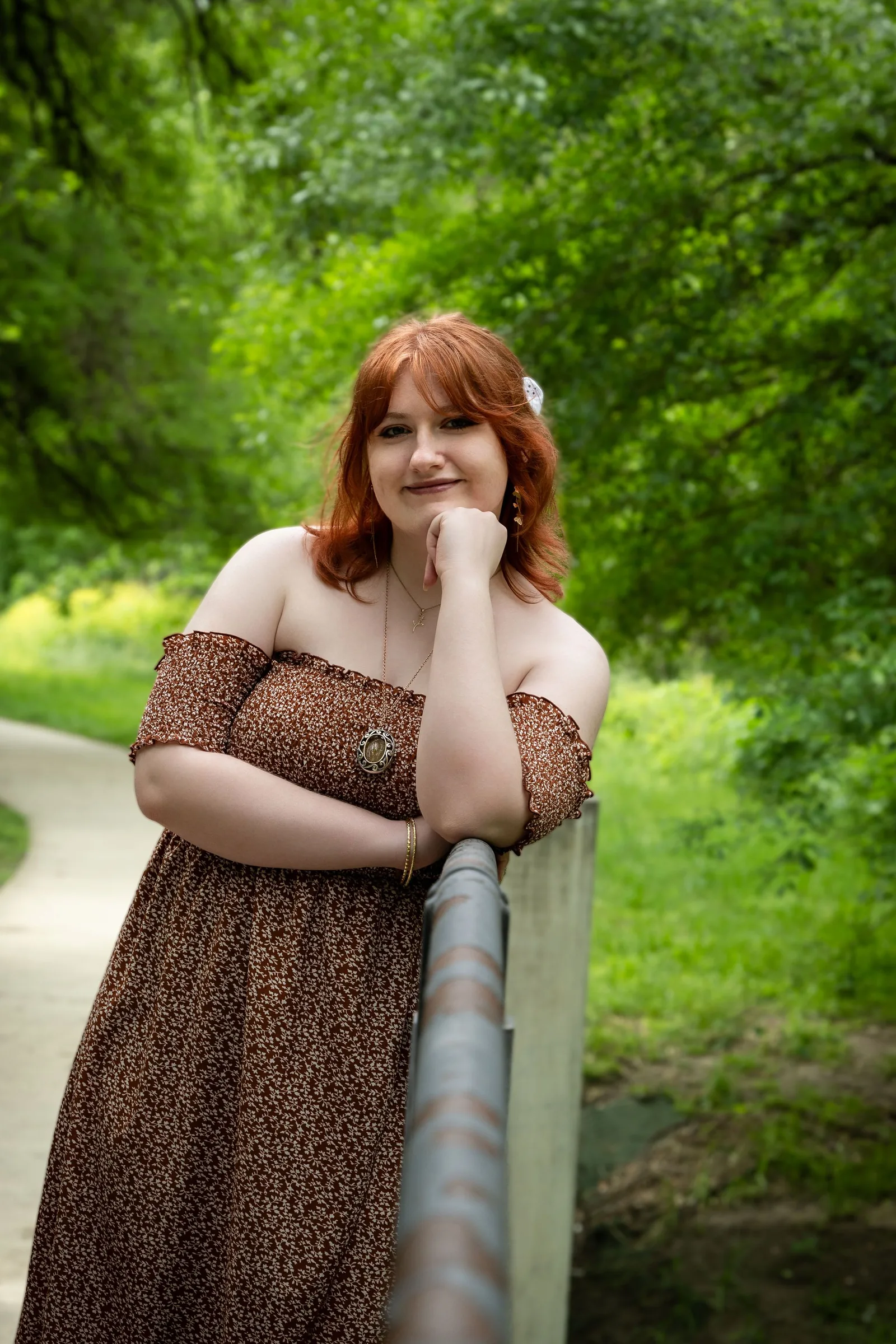 High school senior photographed outdoors in a relaxed lifestyle session